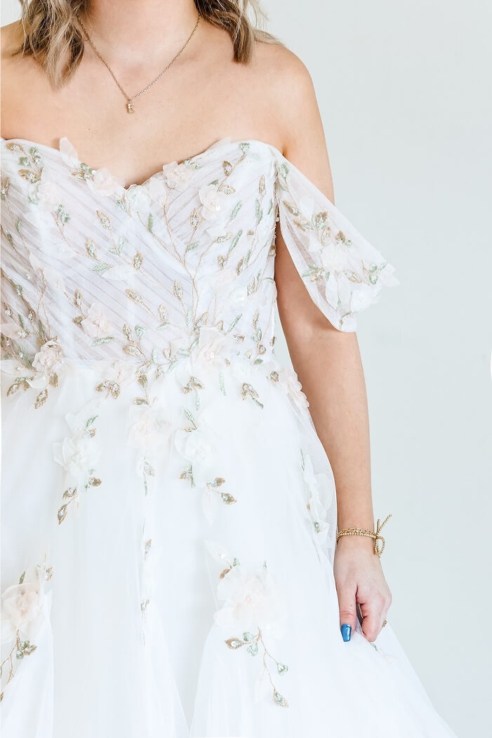 Model wearing a white dress